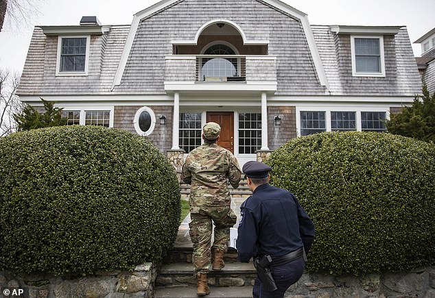 26530802-0-guards_approach_a_property_to_check_for_new_yorkers_rhode_island-a-16_1585429799353.jpg